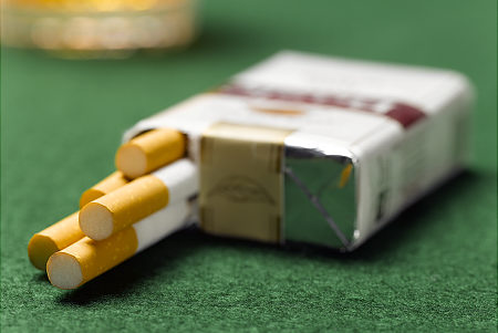 Cigarette pack open on table, close-up   Original Filename: 200551047-001.jpg
