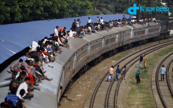 Bangladeshi Muslims sit the top of a train as they try to head b