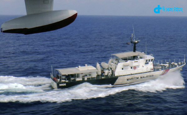 In this photo released by Malaysian Maritime Enforcement Agency, a patrol vessel of Malaysian Maritime Enforcement Agency searches for the missing Malaysia Airlines plane off Tok Bali Beach in Kelantan, Malaysia, Sunday, March 9, 2014. Military radar indicates that the missing Boeing 777 jet may have turned back, Malaysias air force chief said Sunday as scores of ships and aircraft from across Asia resumed a hunt for the plane and its 239 passengers. (AP Photo/Malaysian Maritime Enforcement Agency)